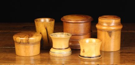 Six Antique Turned Treen Containers: Two small boxwood cups with flared rims and painted faux ebony
