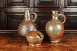 Two Antique Pottery Bottle Flasks: A small 18th century brown stoneware baluster flask having a