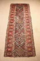 An Antique Part Runner (A/F) 107½" x 42½" (273 cm x 108 cm).