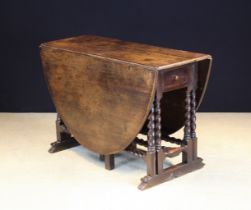 A Rare 17th Century Oak & Cedar Gateleg Dining Table.