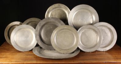 A Group of Nine 18th Century Pewter Chargers & A Large Oval Platter 22¾" x 17½" (57.5 cm x 44.5 cm).