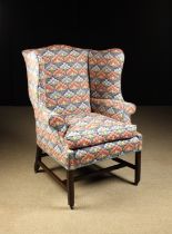 An 18th Century Walnut & Bargello Needlework Wing Armchair.