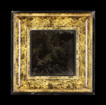 A Deep Cavetto Moulded Faux Tortoiseshell Picture Frame containing a rectangular distressed mirror,