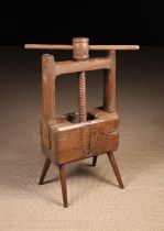 An Early 19th Century Rustic Cheese Press with a screw thread clamp (lacking press plate),