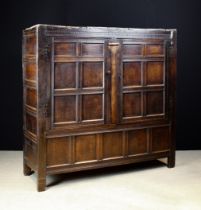 A Large Late 17th/ Early 18th Century Panelled Oak Press Cupboard.