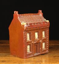 A 19th Century Lead Glazed Earthenware Money Box Modelled in the form of a House moulded with