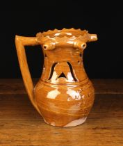 A Burton in Londsdale Agate ware Puzzle Jug swirled in yellow and reddish brown glaze,