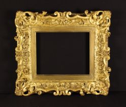 A Fine 19th Century Carved & Gilded Picture Frame ornately decorated with open waves of crested