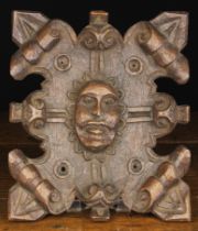 A Carved Oak Cartouche Panel emblazoned with a relief carved facemask of a bearded man to the