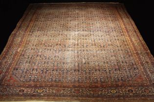 An Antique Feraghan Carpet, worn. 169" x 156" (430 cm x 397 cm).
