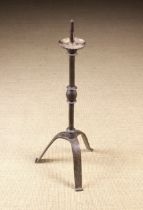 A Wrought Iron Pricket Stick with crimped drip pan on a faceted stem centred by a fillet & egg knop,