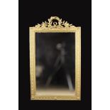 A Rectangular Wall Mirror in a gilt frame moulded with a band of entwined bellflower chains and