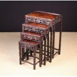 A Chinese Quartetto of Carved Hardwood Nesting Tables.