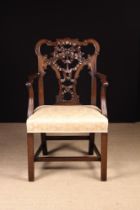 A Chippendale Style Carved Mahogany 'Ribbon-back' Armchair.