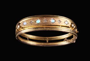 A Fine Nine Carat Gold Bracelet set with four opals alternated with diamonds and housed in a case