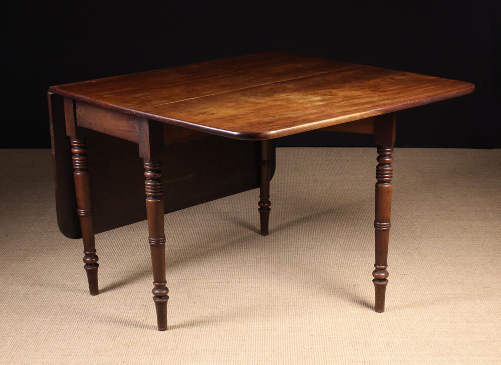 A George IV Mahogany Drop Leaf Dining Table. - Image 2 of 2