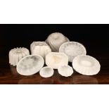 A Group of Nine White Ceramic Culinary Moulds.