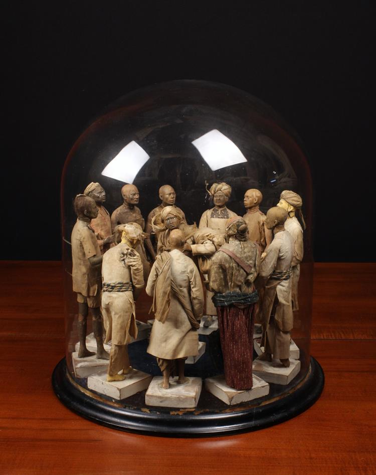 An Unusual 19th Century Display of Twelve Arabian Terracotta Figures;