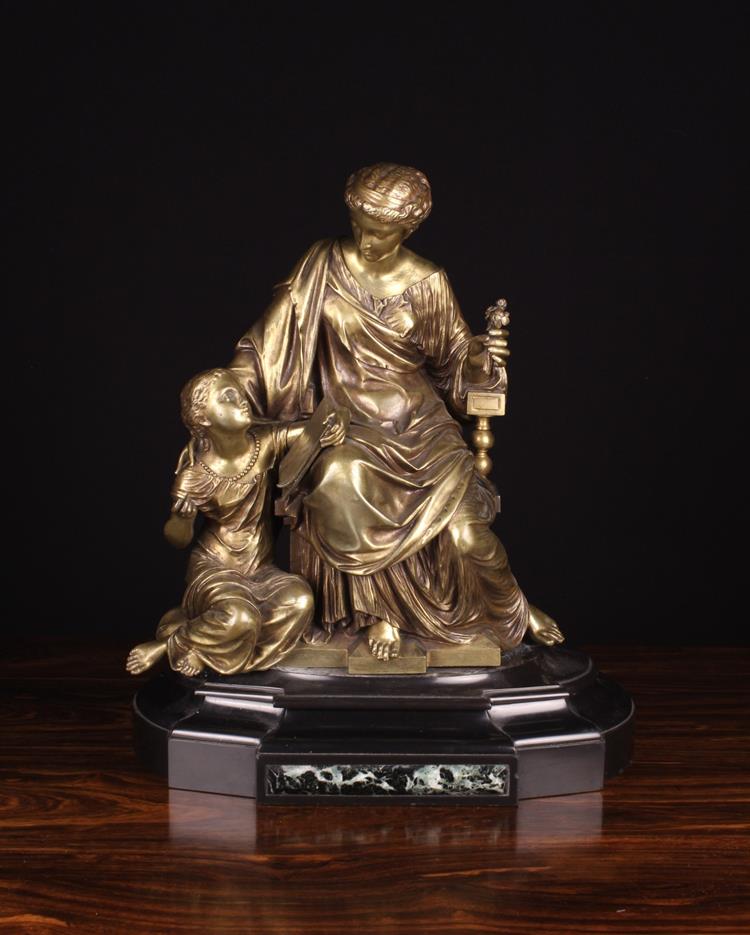 A 19th Century Gold Patinated Bronze Figure Group cast with a seated Classical female and a young