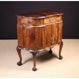 A Vintage Queen Anne Inspired Figured Walnut Serpentine-front Cabinet inlaid with feather banding.