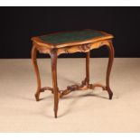 A Small Late 19th Century Carved Walnut Writing Table in the Louis XV Style.