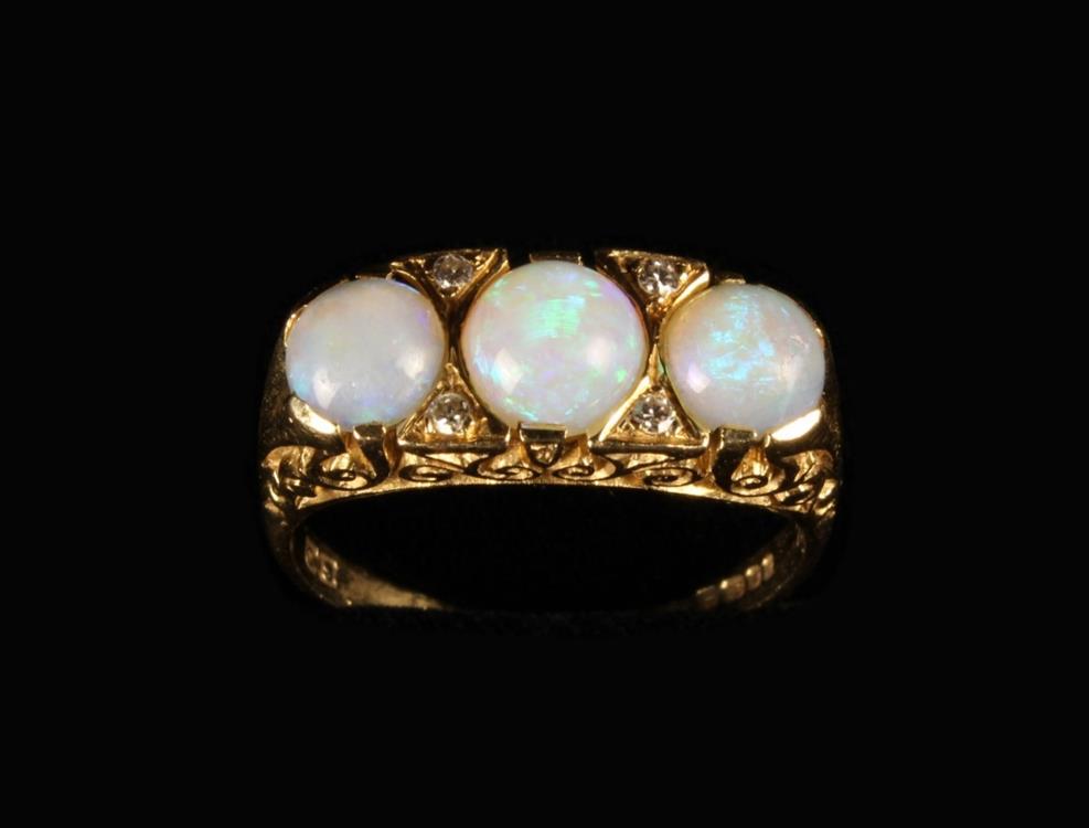 An 18 Carat Gold & Opal Ring set with three cabochon stones. UK size O/P, US 7.5. - Image 2 of 3