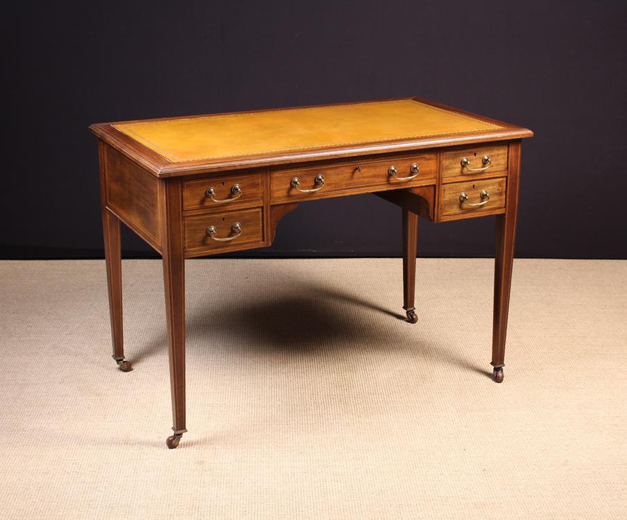 A Fine Edwardian Inlaid Mahogany Writing Table stamped with London maker's name Howard & Sons Ltd
