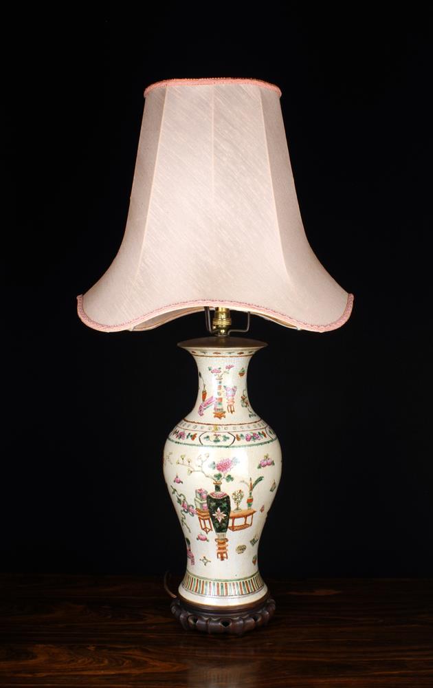 A Tall Chinese Pot Lamp.
