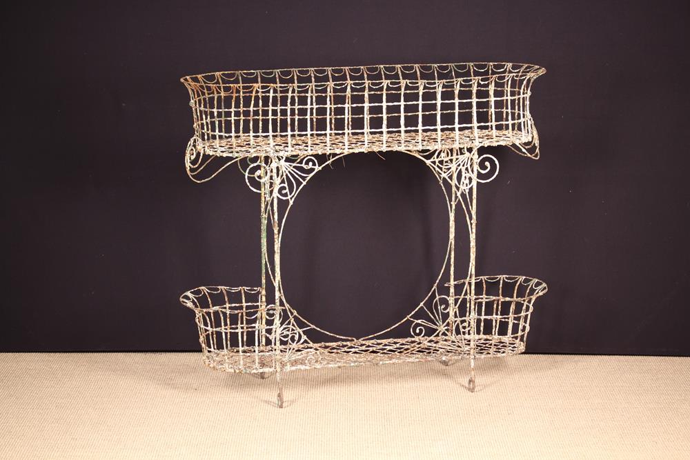 A Victorian Painted Wire Two Tier Plant Stand, 37" (94 cm) high, 41½" (106 cm) wide, - Image 2 of 2