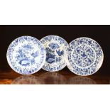 Three 18th Century Blue & White Delft Chargers: A pair painted with stork and flowers to the centre