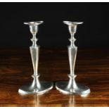 A Pair of Silver Navette Shaped Candlesticks London 1909, 9" (23 cm) in height.