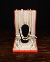 A Group of Simulated Pearl Necklaces: A long twin strand necklace with diamonté clasp.