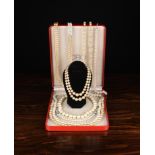 A Group of Simulated Pearl Necklaces: A long twin strand necklace with diamonté clasp.