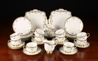 A Pretty Paragon Fine Bone China Teaset decorated with floral sprigs enhanced with turquoise enamel