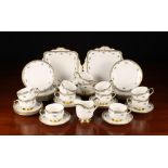 A Pretty Paragon Fine Bone China Teaset decorated with floral sprigs enhanced with turquoise enamel