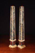 A Pair of Tall Early 20th Century Brêche Marble Obelisks with faceted rouge marble caps,