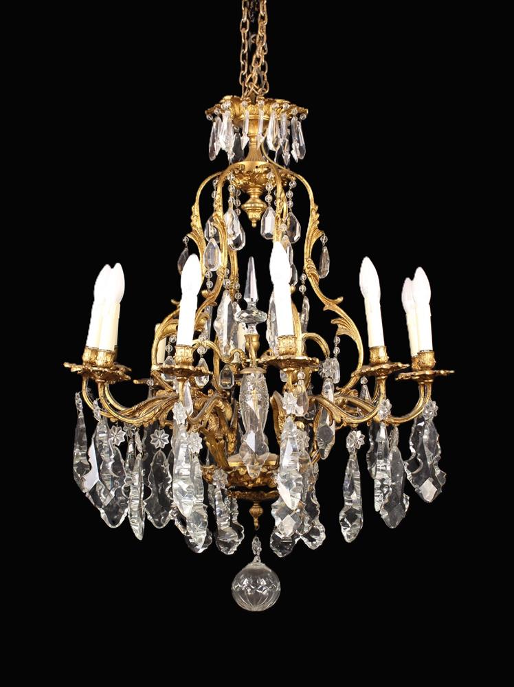 A Twelve Branch Gilt Metal Chandelier in the Louis XV Style.