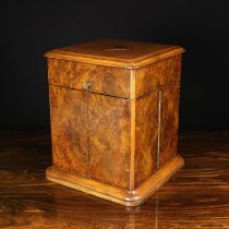 A 19th Century Burr Walnut Four Bottle Decanter Box having a hinged lid and two swing out