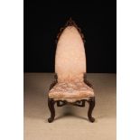 An Unusual, Gothic Revival, Upholstered Victorian Nursing Chair covered in floral woven pink fabric.