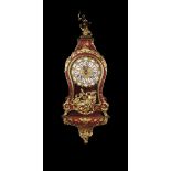 A Lacquered French Régence Style Bracket Clock painted with sprays of roses and adorned with