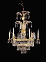 An Attractive French Empire Style Gilt Metal & Cut Glass Chandelier adorned with a waterfall of