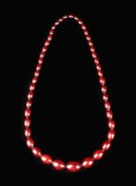 A Cherry Amber Necklace of graduated oval beads (approx 72 g).