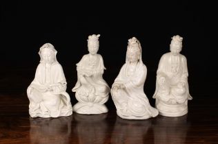 A Group of Four Late 19th Century Blanc de Chine Guanyin Figures,