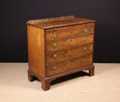 A Late Georgian Flame Mahogany Chest of Drawers with brushing slide.