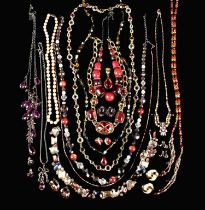 A Group of Costume Jewellery; necklaces & earrings in a predominantly red palette.