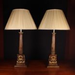 A Pair of Large Turned Walnut Columnar Side Lamps on square plinth bases ornamented with carved &