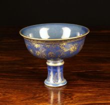 A Chinese Stem Bowl with gilt decoration on a powdered blue ground, 4¼" (11 cm) high,