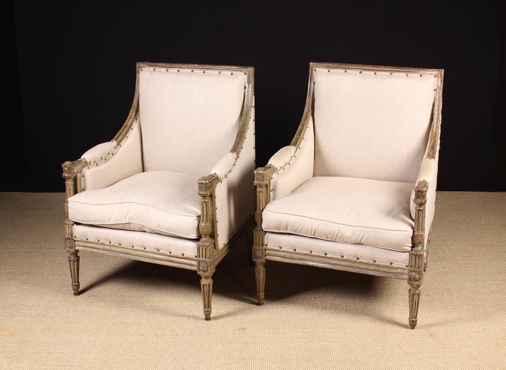 A Pair of Louis XVI Style Carved & Painted Armchairs.