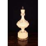 An Ornamental Side Lamp with a pale yellow glazed urn shaped ceramic body encrusted with rose