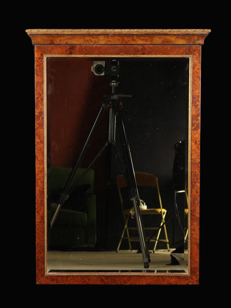 A Rectangular Bevel-edged Wall Mirror in a burr walnut effect frame with gilt trim and moulded top,